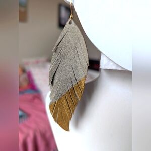 Etsy handmade leather feather fringe, gold dipped earrings. Light grey